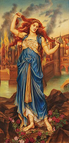 A woman is in the foreground. She is pulling on her thick red hair. She's wearing a blue dress and sandals. There are flowers at her feet. An old city is burning behind her, with smoke rising in to the sky.