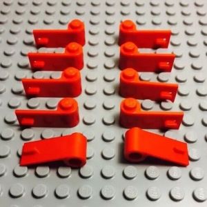 Eight red lego car doors are laid out in two rows, 4 driver-side doors and 4 passenger-side doors. They are on a large grey lego plate. 