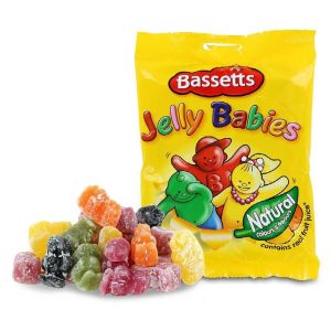 A picture of a package of Bassetts Jelly Babies with assorted Jelly Babies to the side of the yellow bag.